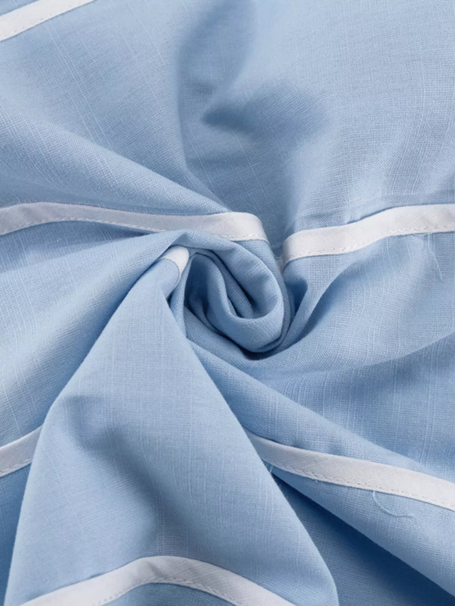 Light blue linen blend fabric with white trim detail.