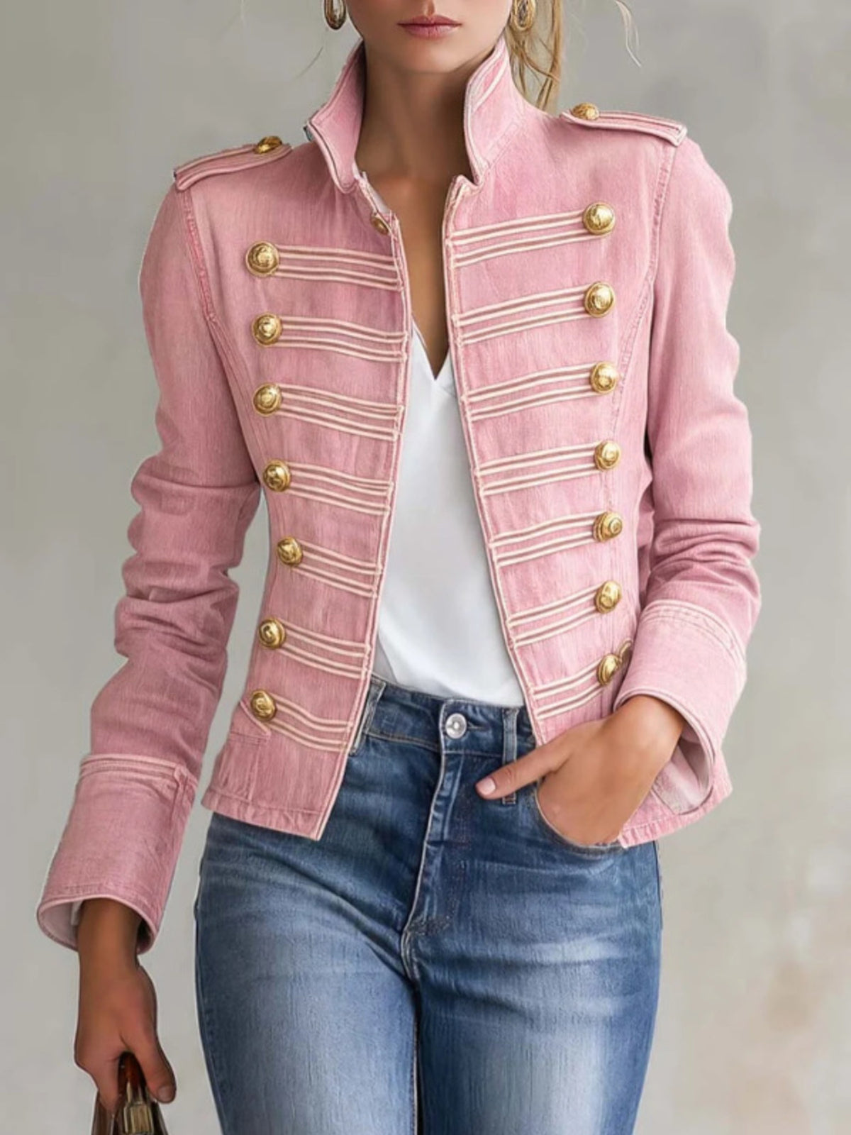 denim jacket in blush pink featuring decorative buttons and fitted fit