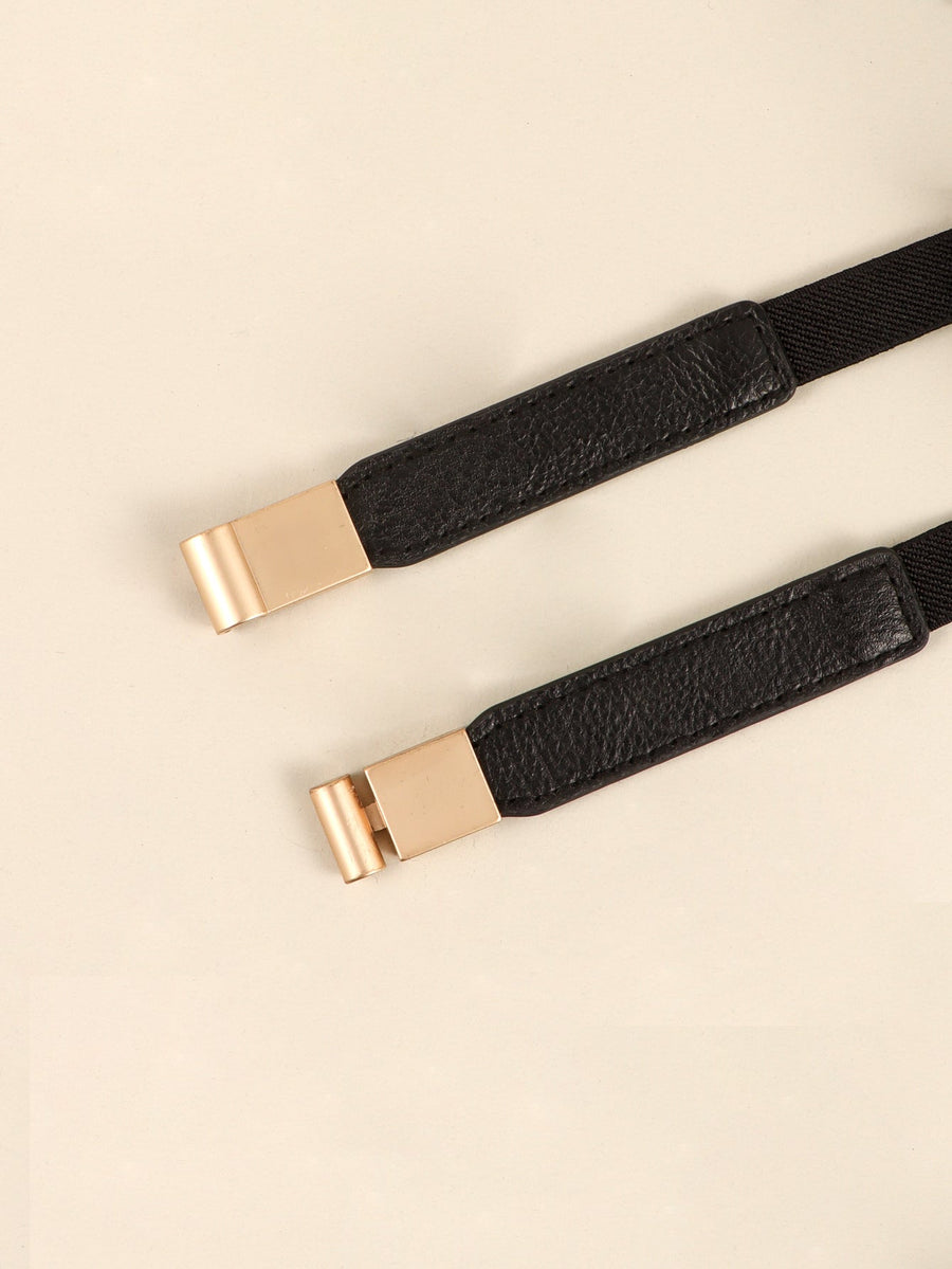 Black elasticated belt with leather detail and gold buckle closure