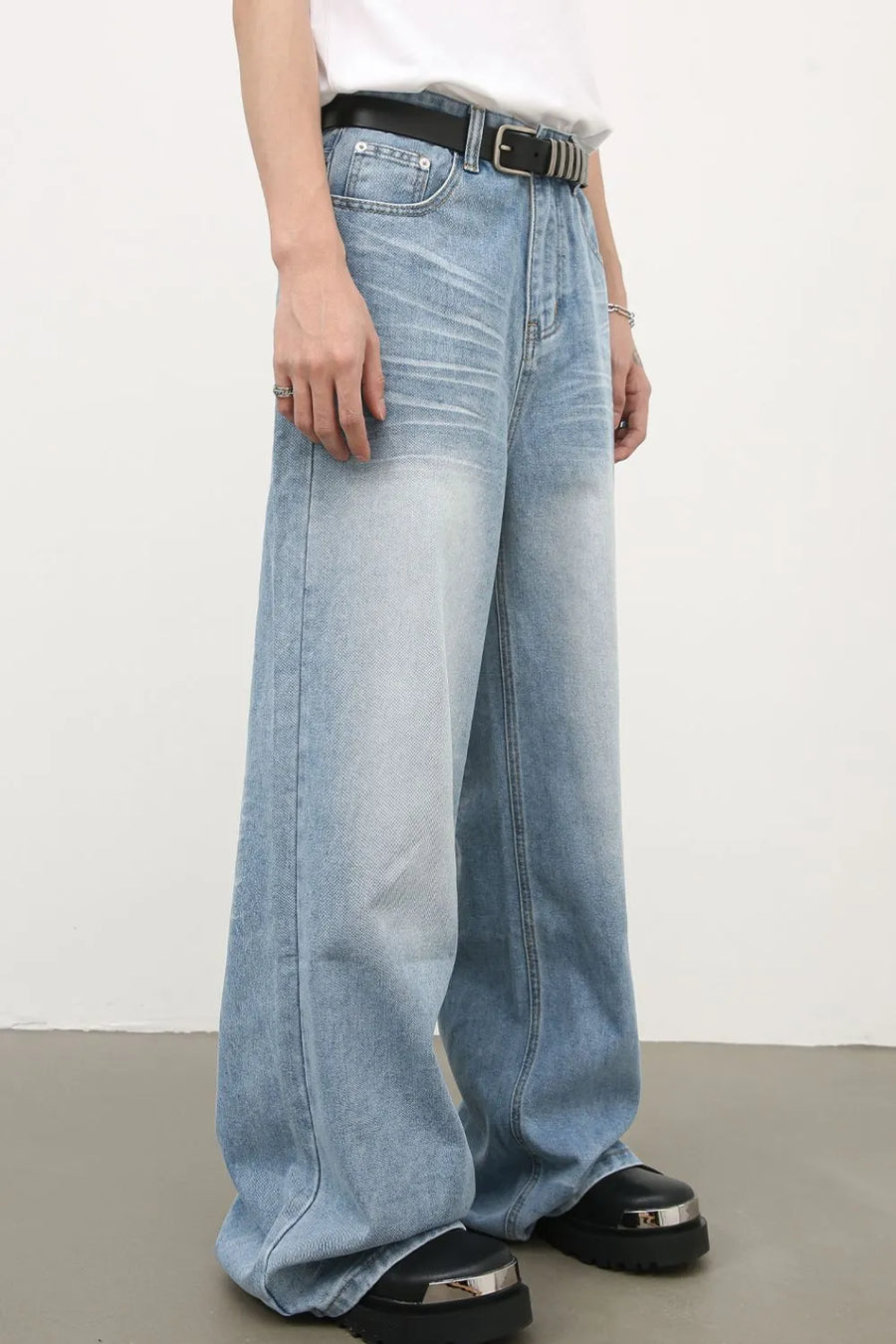 Baggy light blue denim palazzo jeans with a faded wash and wide leg.