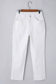 White cotton high-waisted straight leg jeans with ankle length and layered hem detail