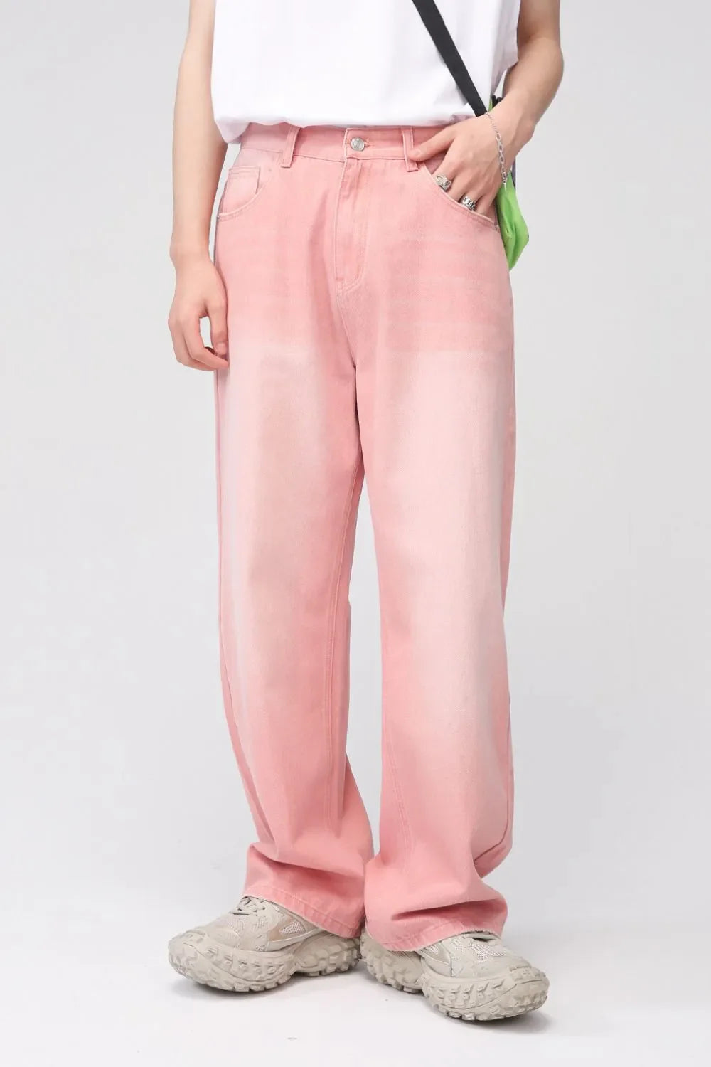 Faded pink wide-leg denim trousers with a casual, relaxed fit.