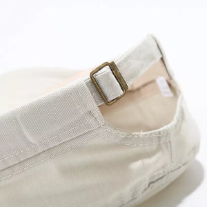 Beige cap with rivet details and N/A