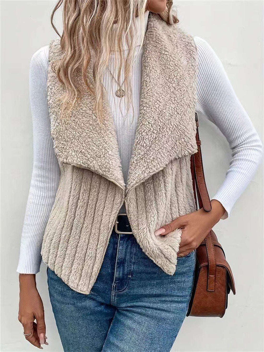 Textured teddy collarless vest in Dust Storm with ribbed detail and open front.