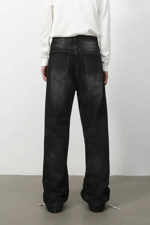 Wide-leg distressed denim jeans in dark vintage wash with a relaxed fit.
