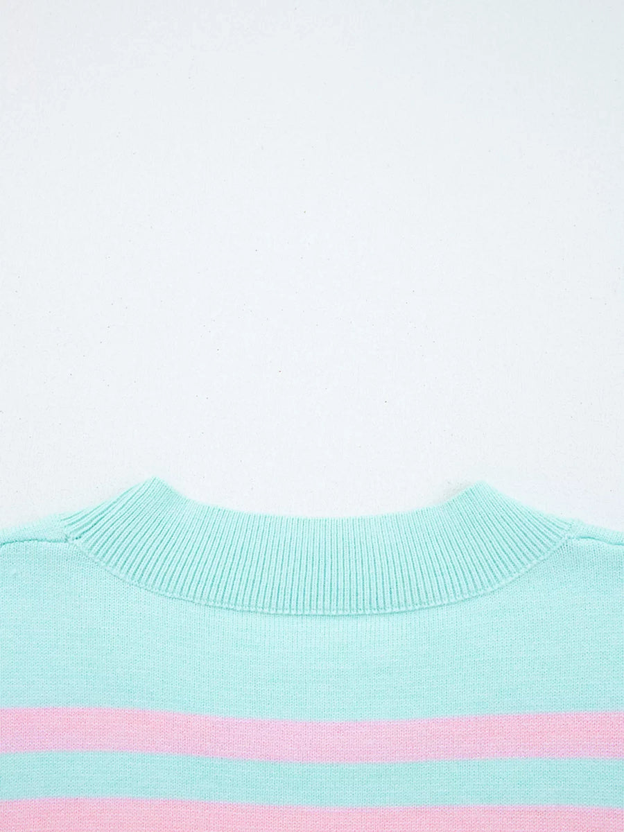 Multicolor striped cropped sweater with a ribbed mock neck.