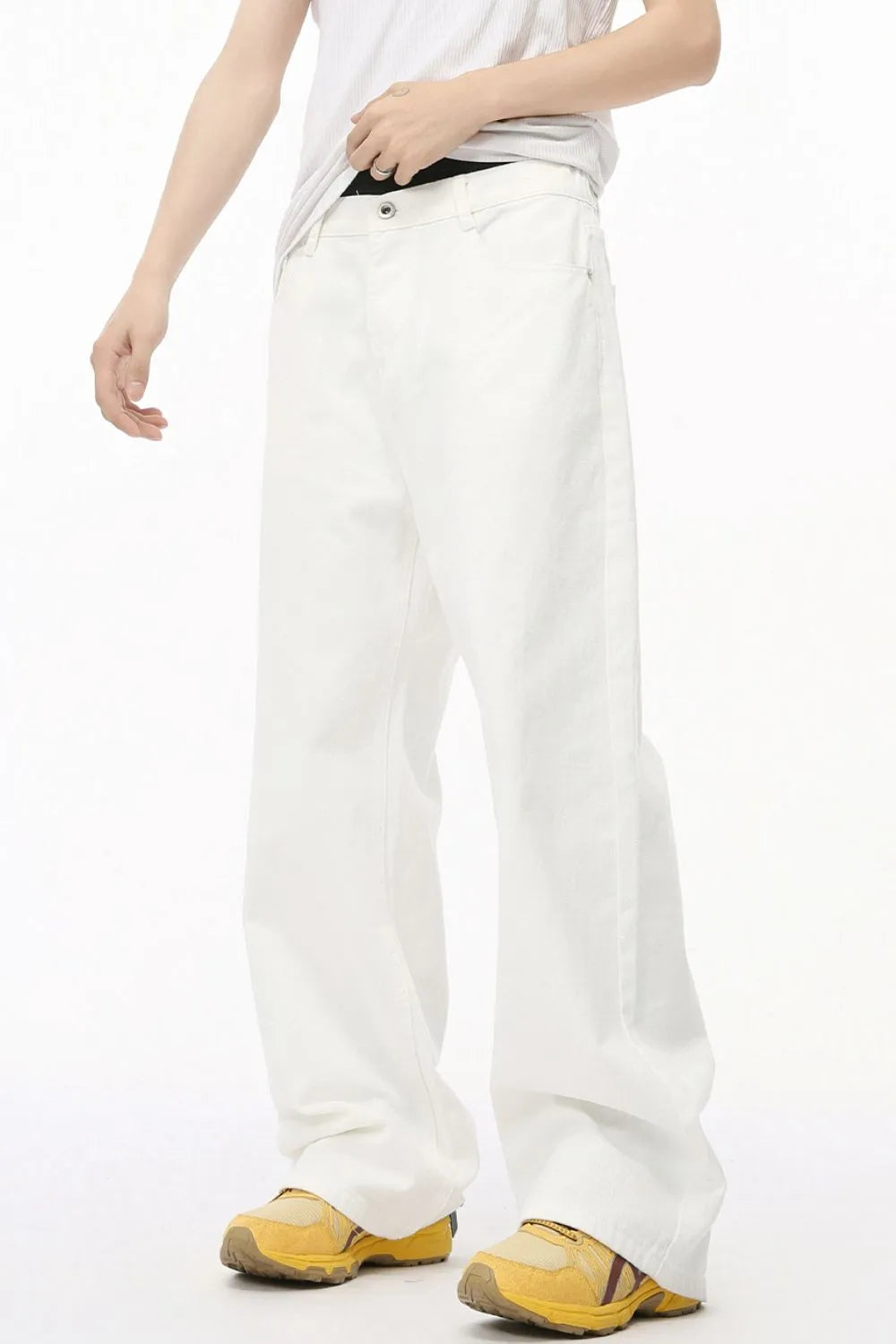 White wide-leg denim trousers with elastic waist and a relaxed fit.