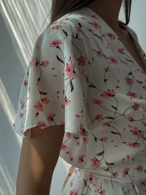 White floral print flutter sleeve dress with V-neckline