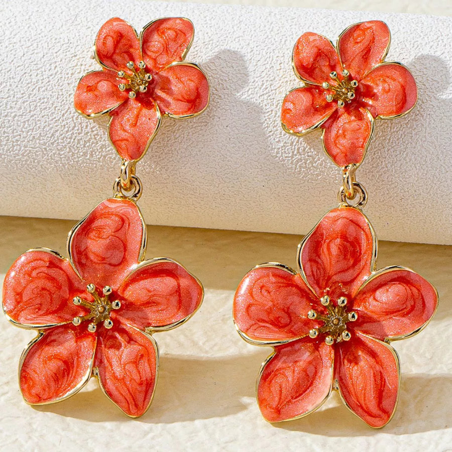 Orange flower dangle earrings with 18K gold plating and intricate detailing.