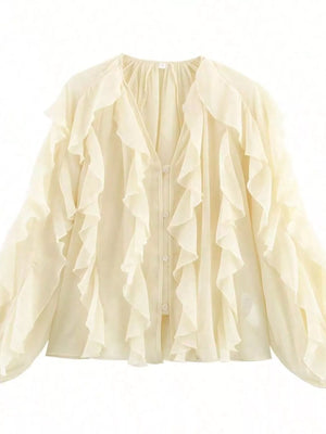 Sheer beige long-sleeve blouse with cascading ruffles and button front.