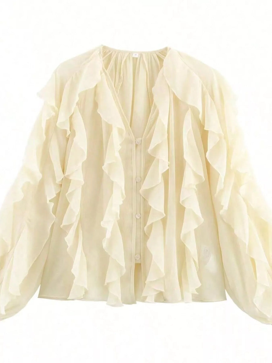 Sheer beige long-sleeve blouse with cascading ruffles and button front.