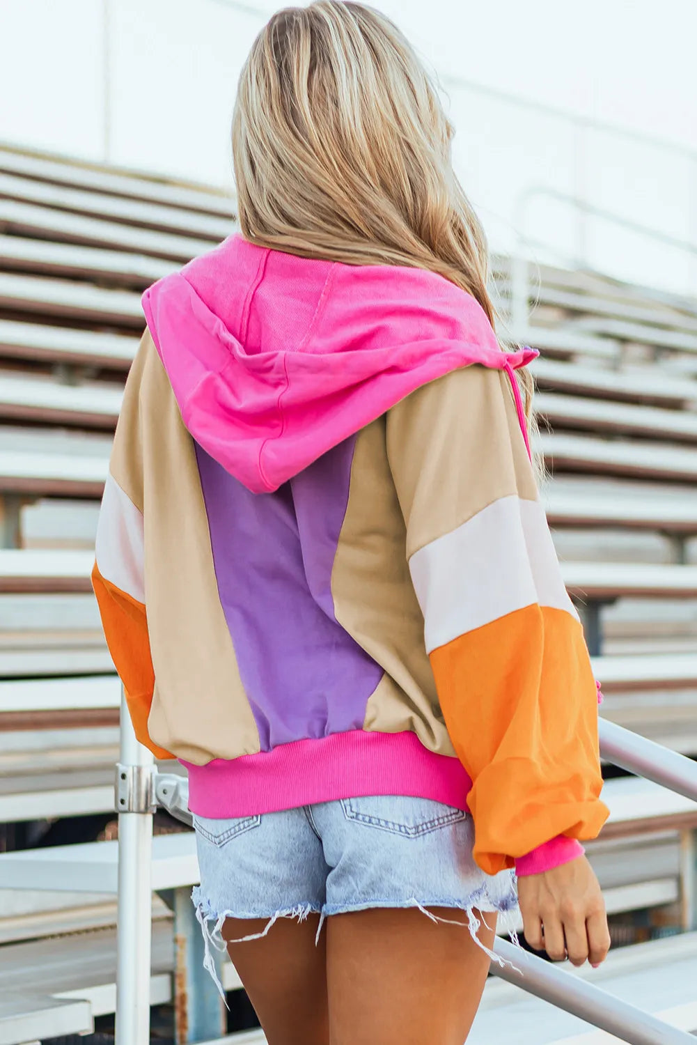 Colorblock balloon sleeve zip-up hoodie in pink, tan, purple, and orange with a drawstring hood.