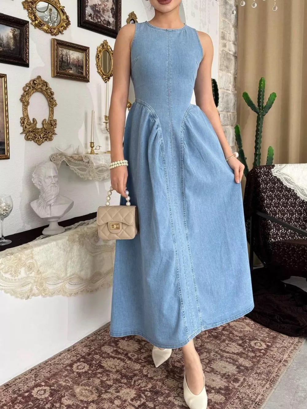 A-line dress in light blue featuring seam detail and A-line fit