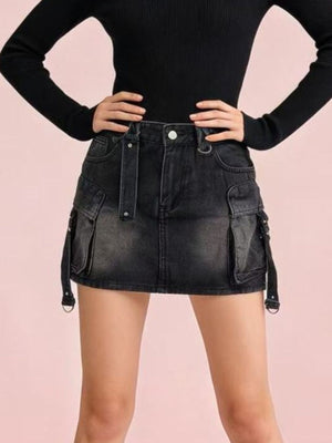 Black washed denim cargo mini skirt with buckle straps and button closure.