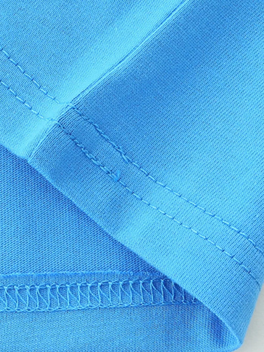 Blue cotton t-shirt detail showing stitching and fabric texture.