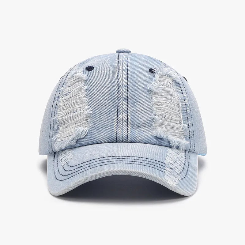 Light denim baseball cap with shredded details and distressed accents.