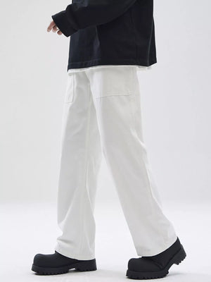 Relaxed fit white cotton chinos with square front pockets.