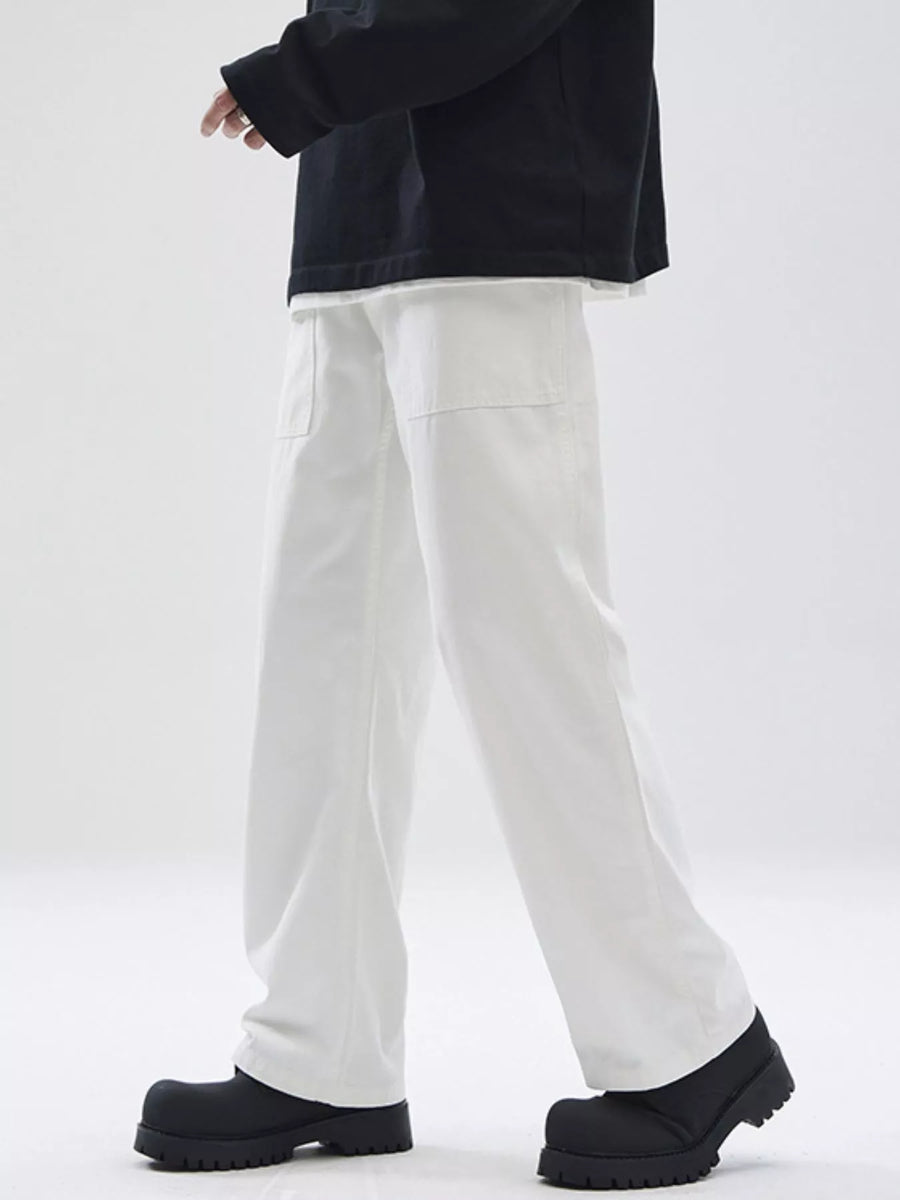 Relaxed fit white cotton chinos with square front pockets.
