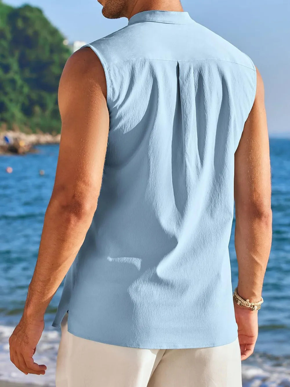 Light Blue sleeveless Mandarin collar shirt with back pleats, casual beach style.