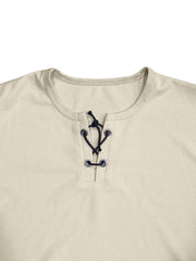 Apricot cotton t-shirt with V-neck lace-up detail and dark blue ties.