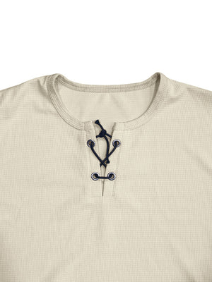 Apricot cotton t-shirt with V-neck lace-up detail and dark blue ties.