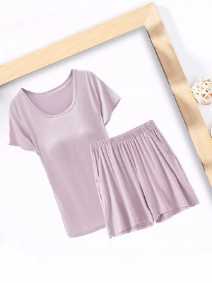 Two-piece pajama set in Bean Paste Powder, featuring a scoop neck tee and elastic waist shorts with pockets.