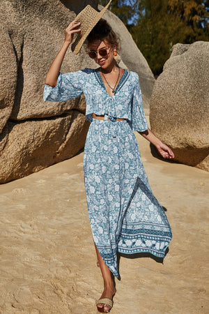 Light blue floral print crop top with tie front and matching maxi skirt with side slit.