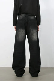 Faded wash wide-leg carpenter jeans in dark black denim with a relaxed fit.
