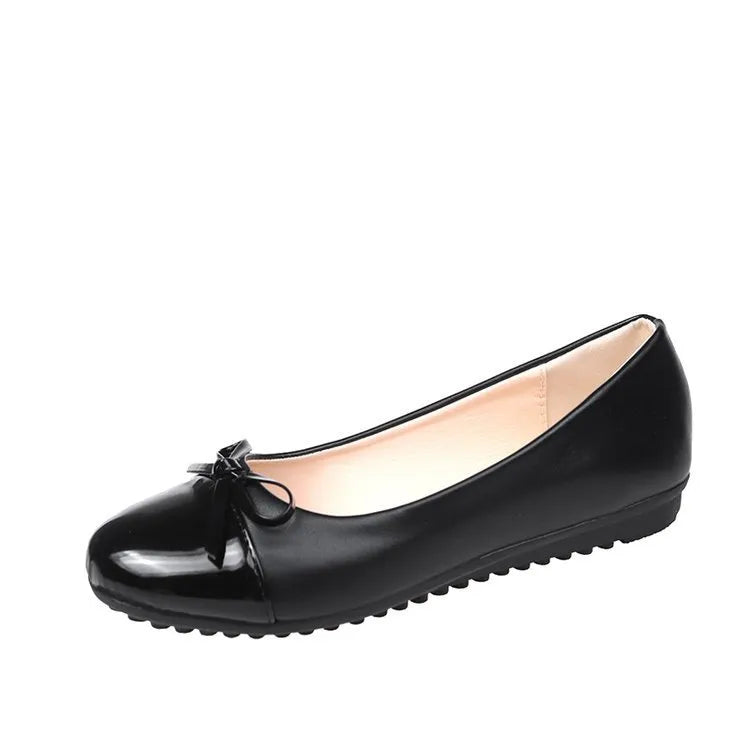 Black patent bow ballet flats with a round toe and comfortable sole.