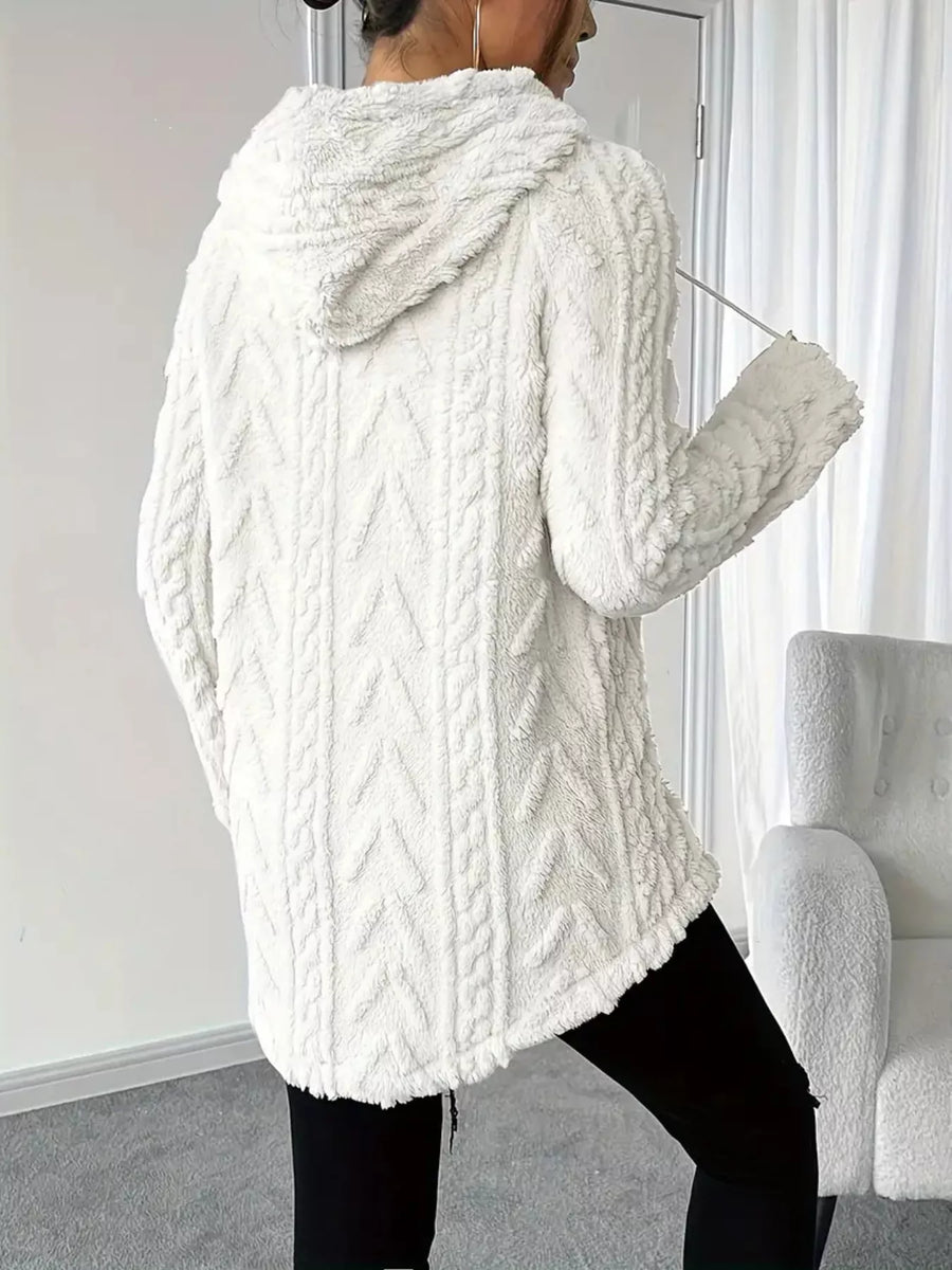 White textured drawstring fleece hoodie with cable knit pattern and hood.