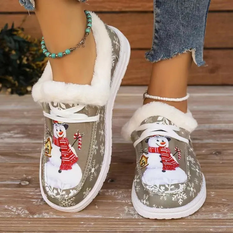 Snowman print faux-fur lined loafers in khaki with snowflake pattern.