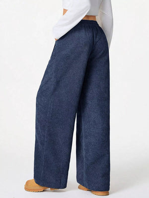 Relaxed blue corduroy pants with drawstring waist and wide leg