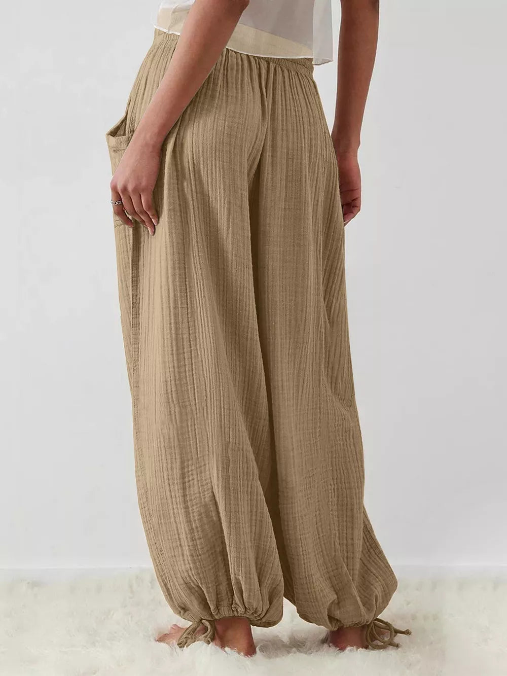 95% polyester, 5% elastane Care instructions: Machine wash cold wide-leg pants in Taupe with loose silhouette
