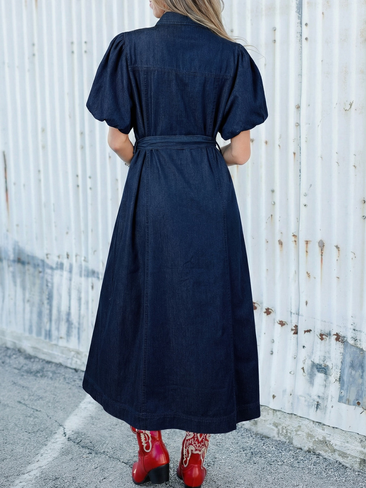 Denim midi dress with belt and puff sleeves, button-down style.