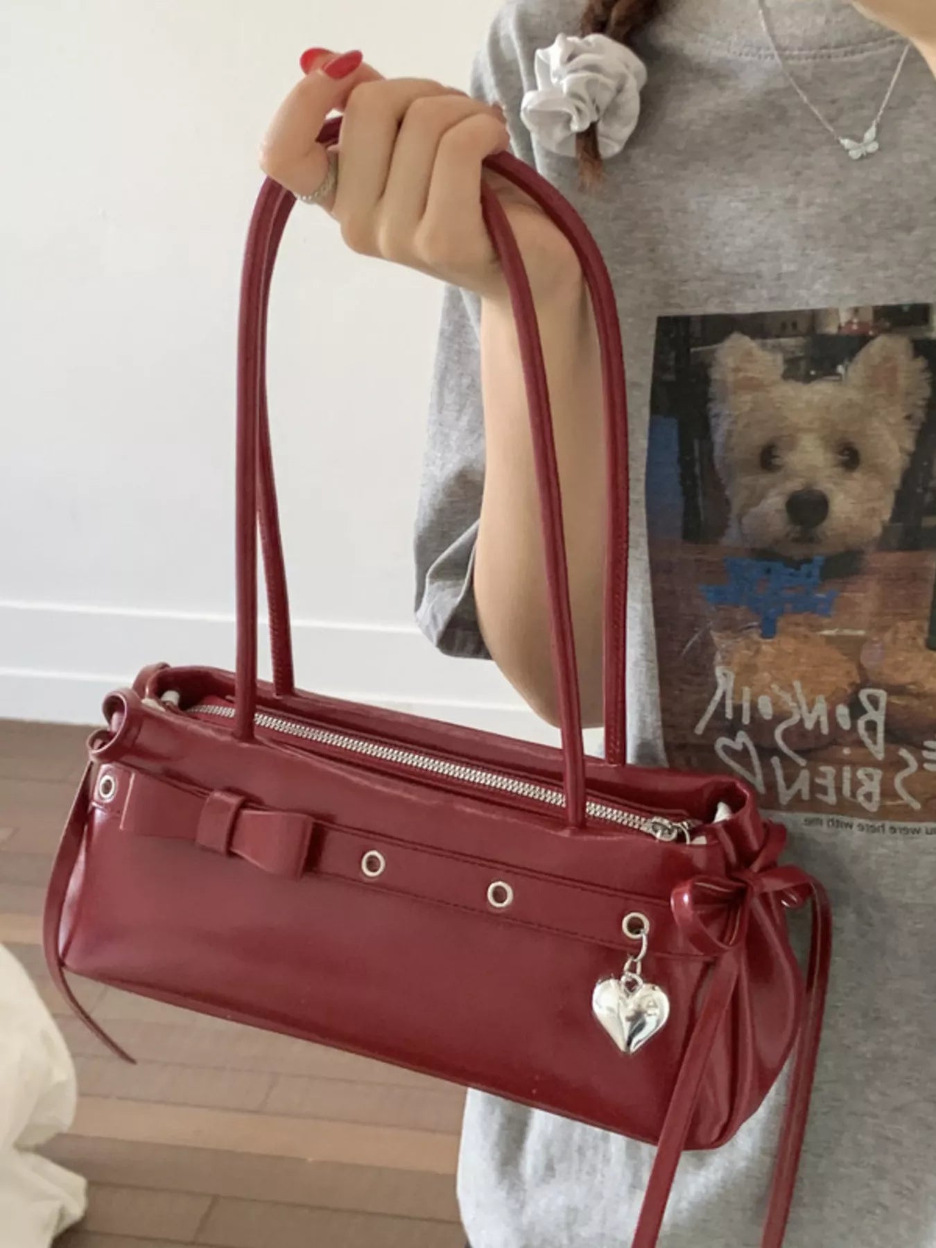 Red PU leather shoulder bag with bow detail and heart charm