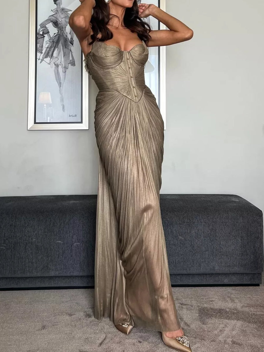 Gold metallic corset maxi gown with draped pleated skirt and lace-up back.