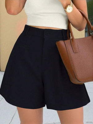 Black high-waisted pleated shorts with pockets and belt loops.