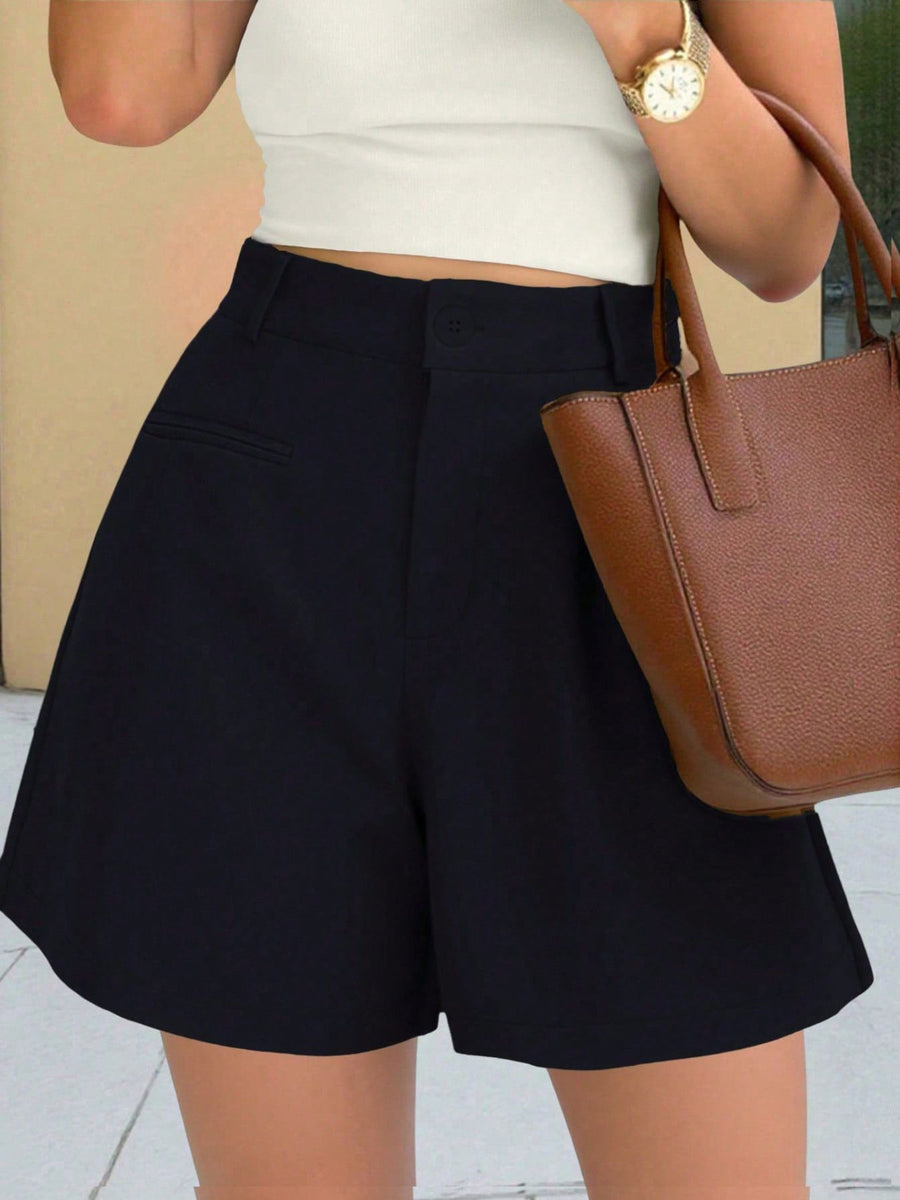 Black high-waisted pleated shorts with pockets and belt loops.
