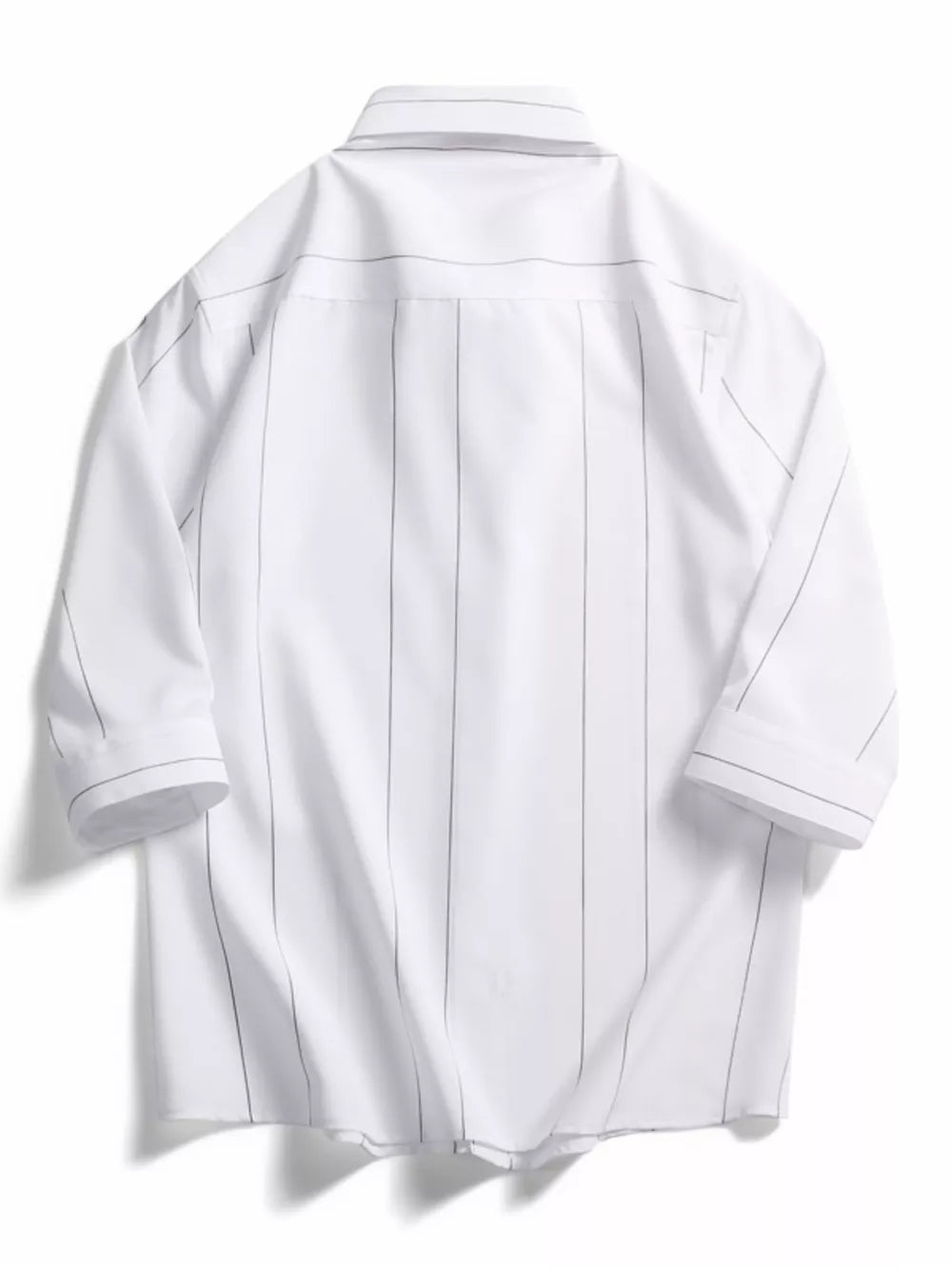 White oversized pinstripe cotton button-down shirt with a classic collar and button cuffs.