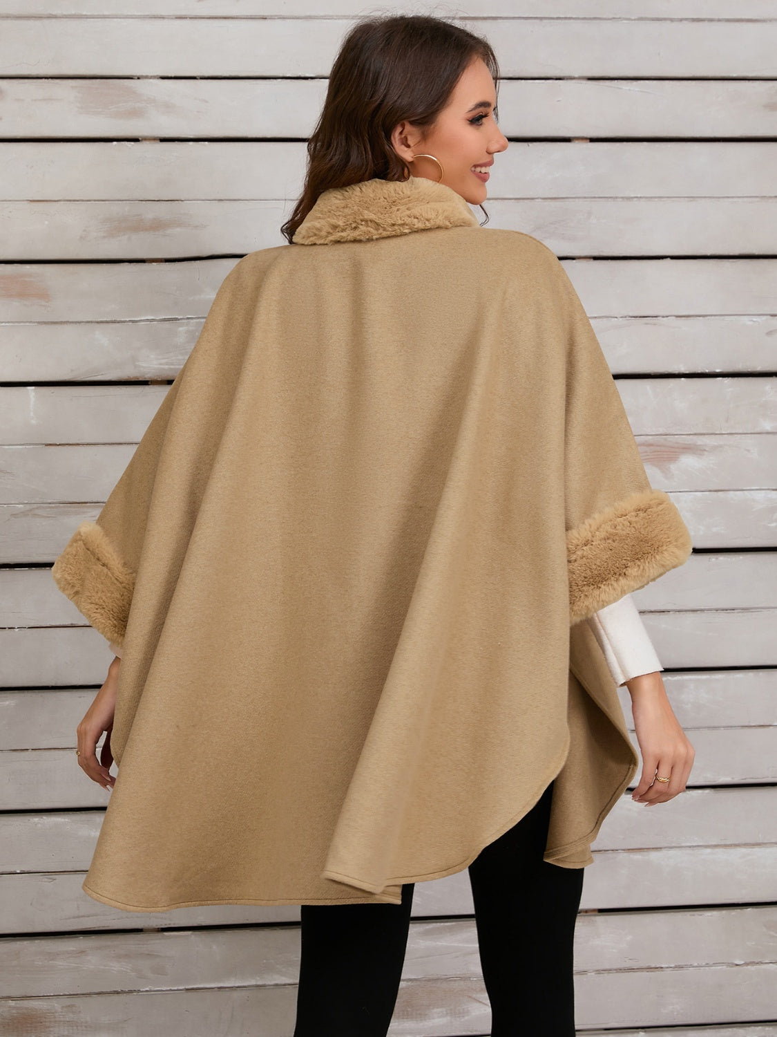 Tan cape coat with faux fur trim on collar and cuffs.