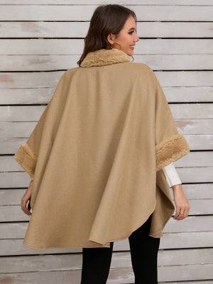 Tan cape coat with faux fur trim on collar and cuffs.