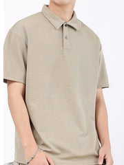 Khaki textured performance polo shirt for men with short sleeves and a two-button placket.