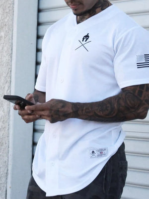 White baseball jersey with graphic detail on chest and sleeve, button front.