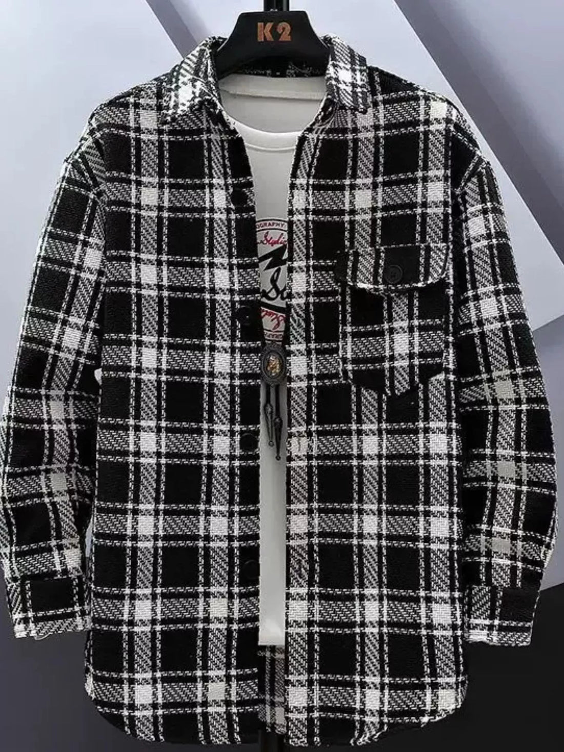 Oversized flannel button-up shirt in White Grid plaid with a cotton blend texture.