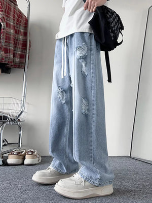 Light blue distressed wide-leg jeans with drawstring and ripped details.