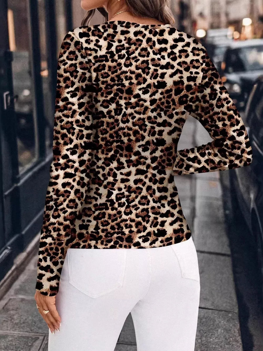 Brown leopard print fitted long sleeve shirt with a crew neck.