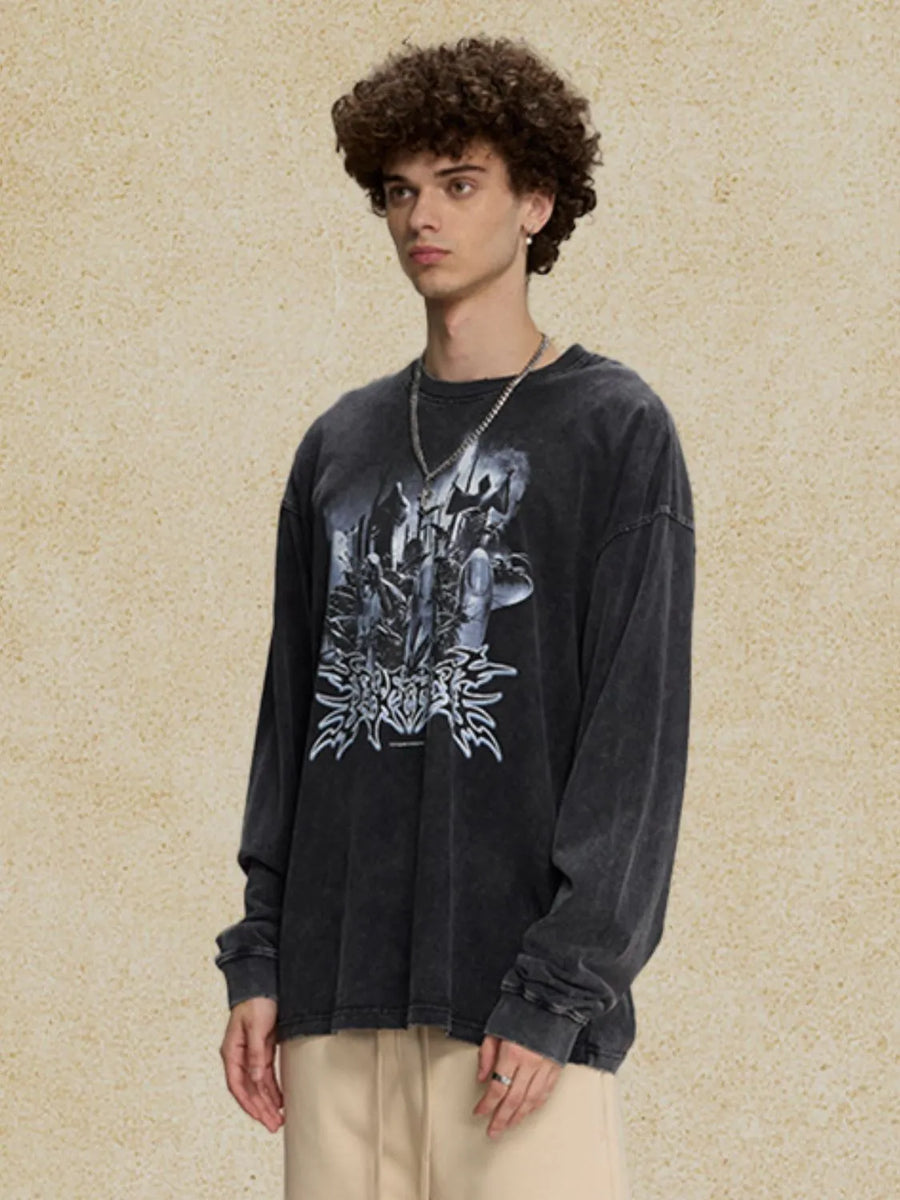Washed black oversized long sleeve t-shirt with a bold graphic print on the front.