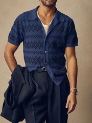 Navy geometric knit camp collar shirt with short sleeves and button front.