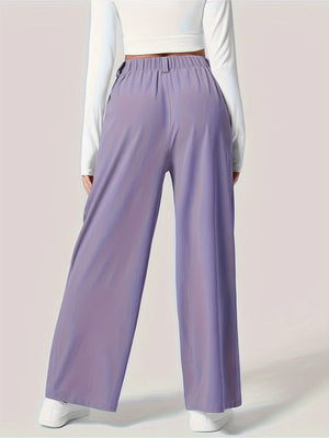 Lilac pleated wide-leg tailored trousers with elastic waistband and belt loops.