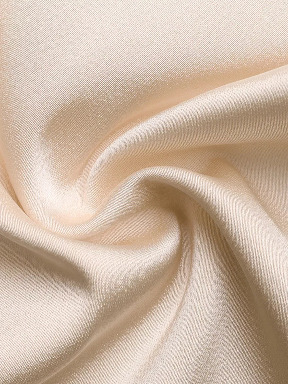 Champagne satin fabric with a subtle sheen and diagonal weave detail.